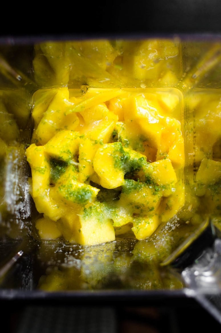 Mango and lime in a blender.