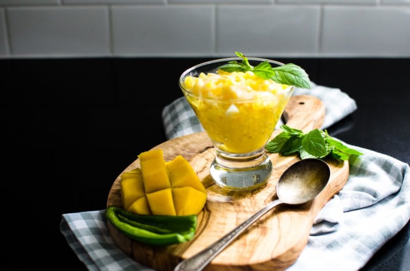 Mango granita next to sliced mango and jalapeno.