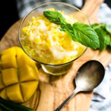 This recipe for summery mango granita is just what the doctor ordered for a hot day - cool, icy and refreshing with a kick from a drizzle of sweet chile milk!