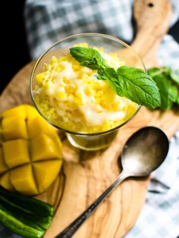 This recipe for summery mango granita is just what the doctor ordered for a hot day - cool, icy and refreshing with a kick from a drizzle of sweet chile milk!