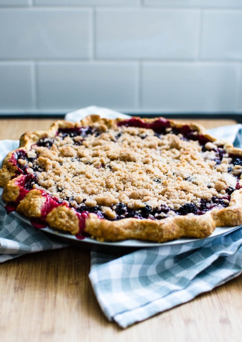 Berry Crumble pie on a plaid serving towel. 