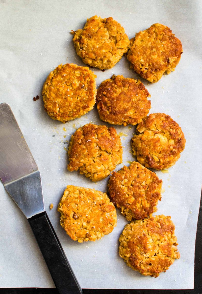 A tray of cooked salmon sliders.