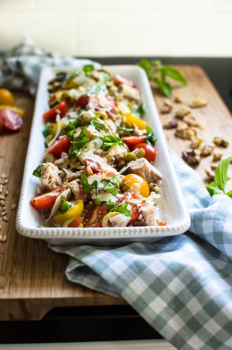 A tray of superfood tuna salad topped with many veggies. 