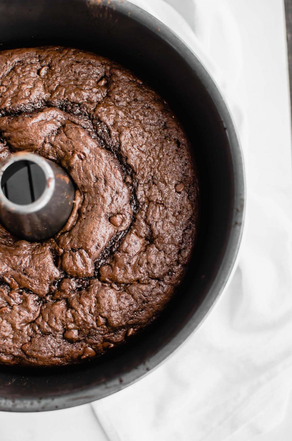 This recipe for Back Pocket Chocolate Fudge Cake is an easy bundt cake that is super moist, fudgy, and extra delicious. It's made with Ghirardelli chocolate, sour cream, and topped with hot fudge and caramel! #valentines #chocolatecake