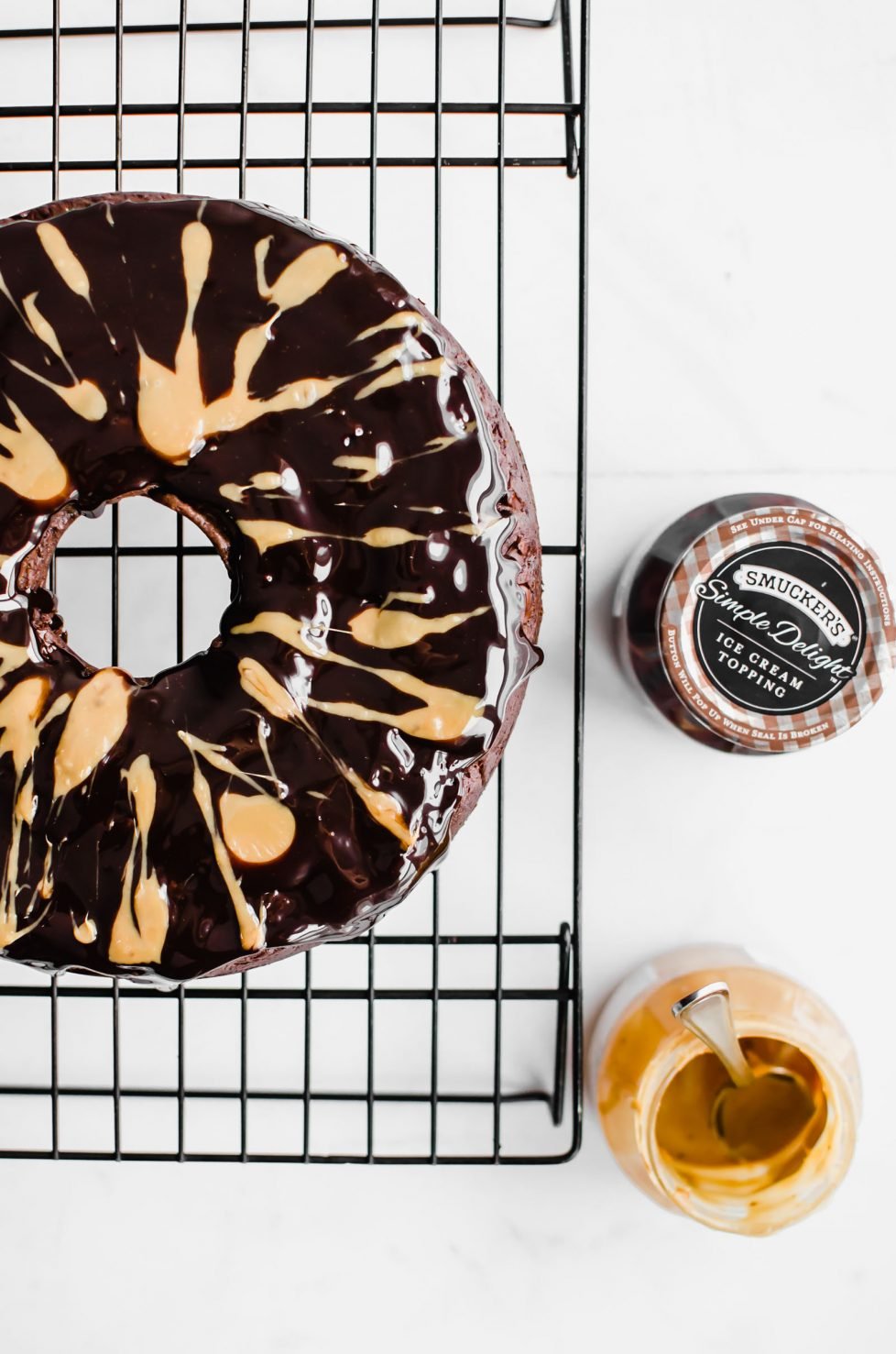 This recipe for Back Pocket Chocolate Fudge Cake is an easy bundt cake that is super moist, fudgy, and extra delicious. It's made with Ghirardelli chocolate, sour cream, and topped with hot fudge and caramel! #valentines #chocolatecake