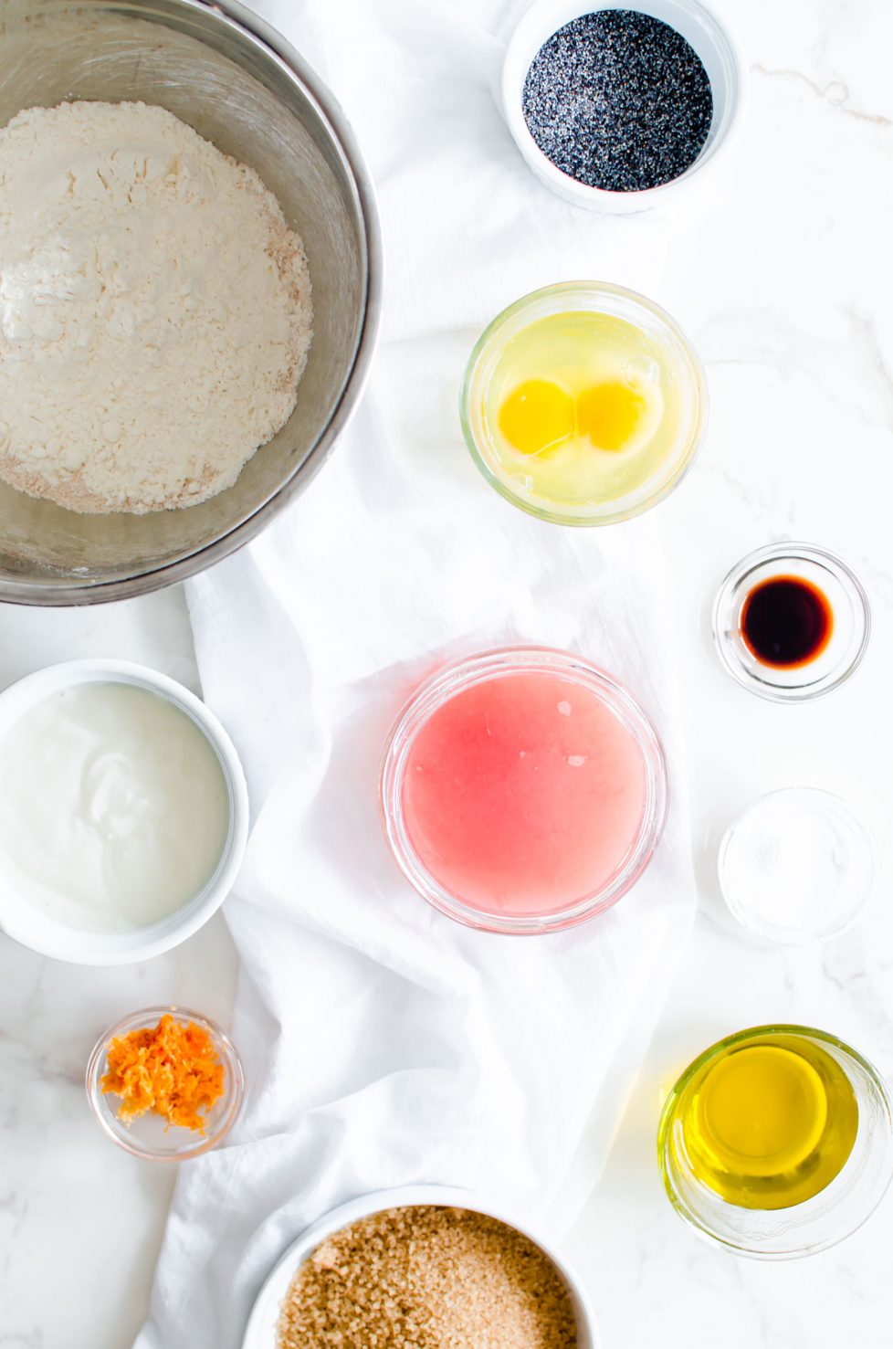 This recipe for Grapefruit Poppy Seed Donuts is perfect for a spring brunch or garden party! They are made with whole grain flour, wholesome Greek yogurt, and coconut sugar with a light citrus glaze. #grapefruit #springrecipes #sweetcayenne