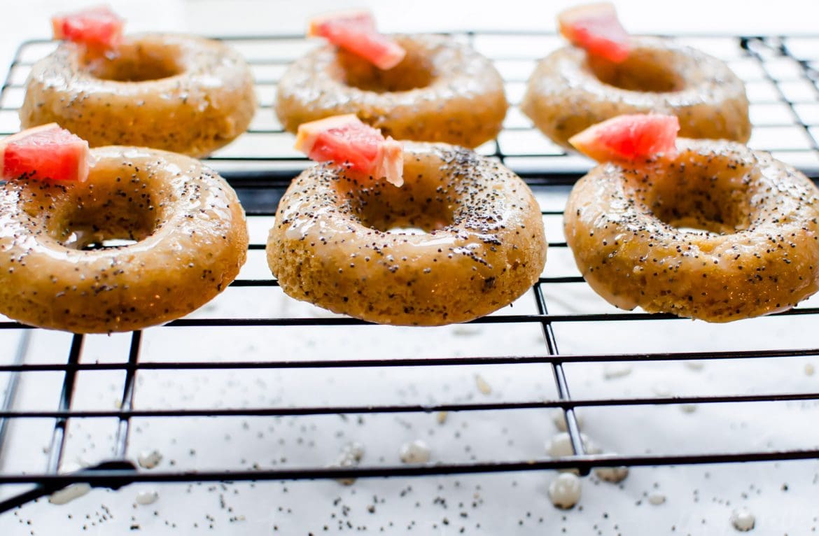 This recipe for Grapefruit Poppy Seed Donuts is perfect for a spring brunch or garden party! They are made with whole grain flour, wholesome Greek yogurt, and coconut sugar with a light citrus glaze. #grapefruit #springrecipes #sweetcayenne