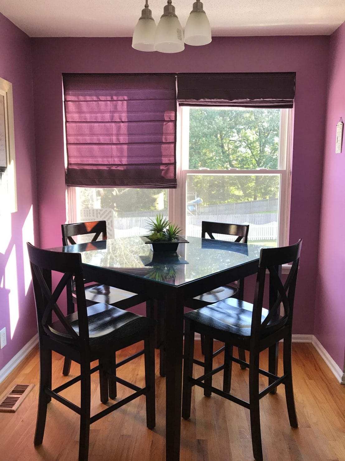 Our mini kitchen makeover featured a redo of the breakfast space. We added new paint and replaced the table with a French marble top island for prep and food photography. #homedecor #interiordesign #kitchenmakeover