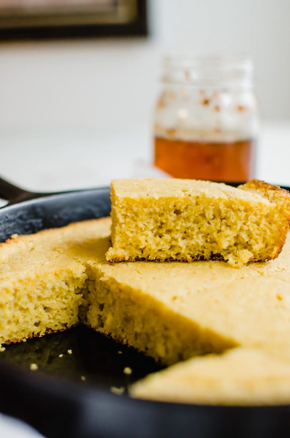 Pan of cornbread with a slice removed.