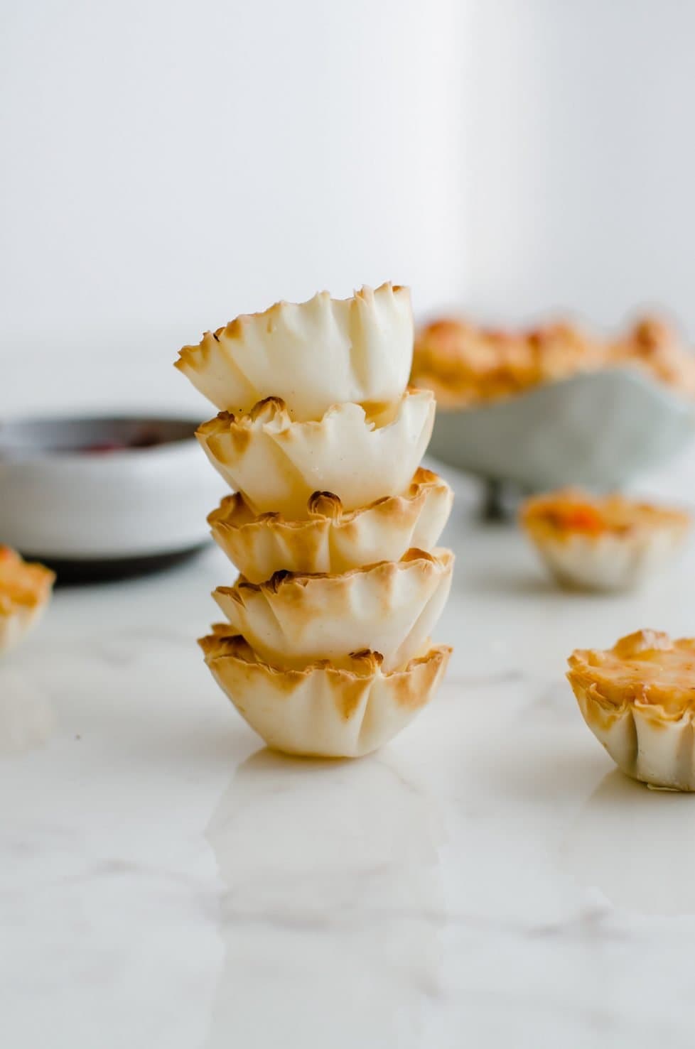 Five tartlets stacked one upon another