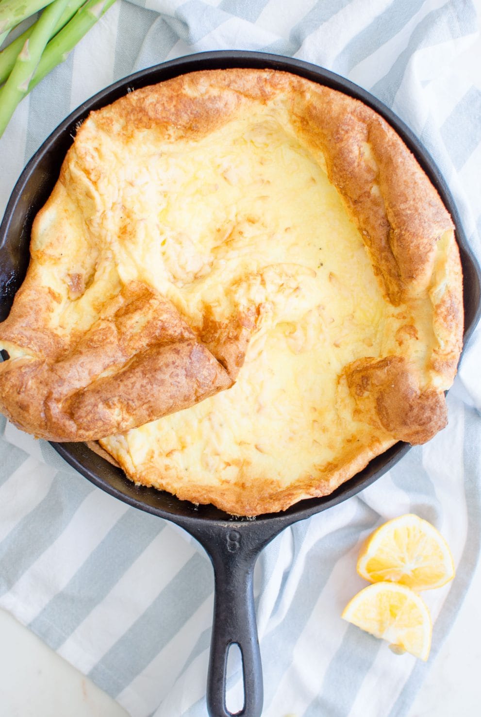 This recipe for a savory Dutch Baby is loaded with fresh springtime flavor and features a nutty Raspberry cheese, tender bites of fresh Asparagus, and salty shaved Serrano ham. 