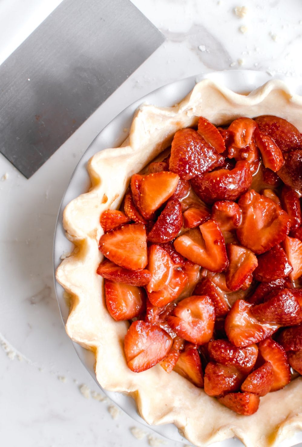 Overhead view of open face strawberry pie.