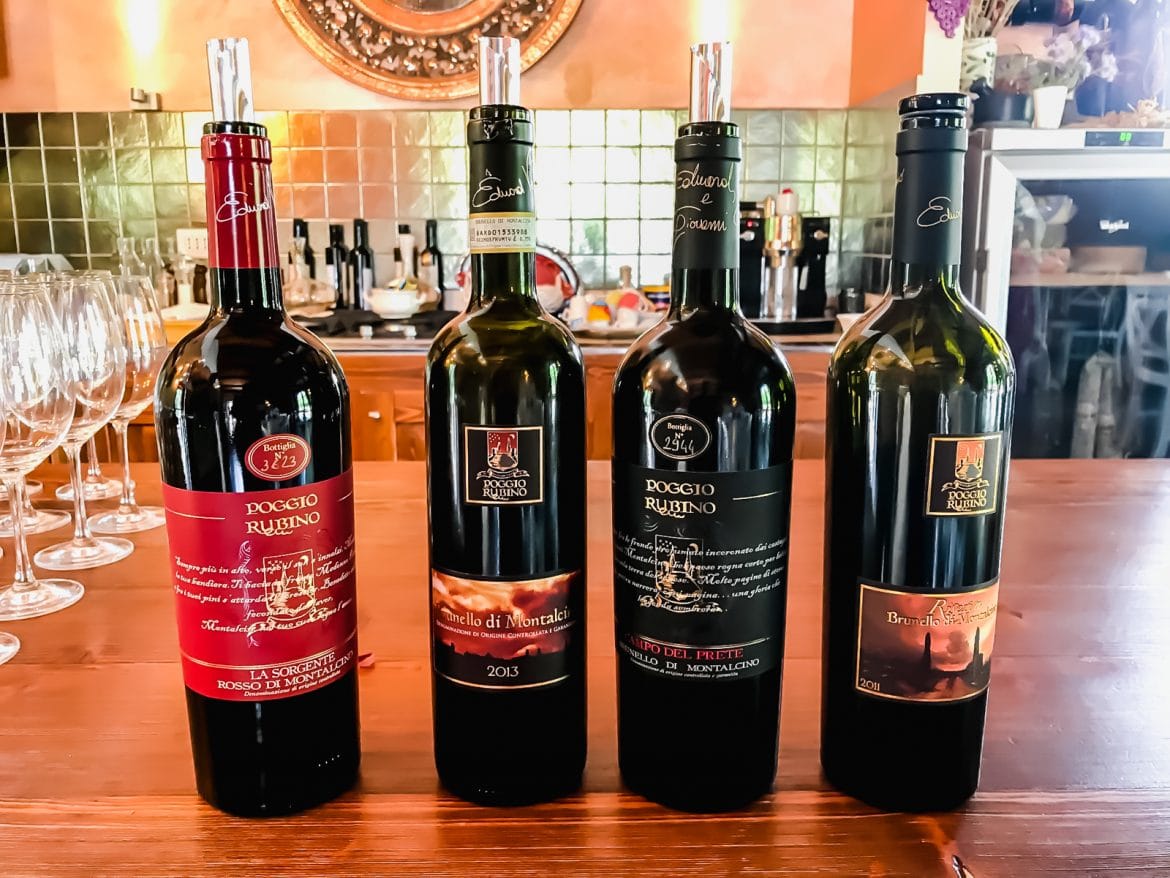 A line of wines set on a counter in the Poggio Rubino winery in Italy.