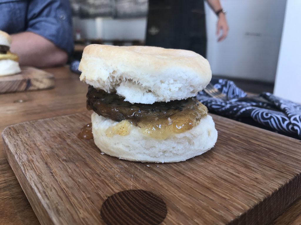 A side shot of a sausage and peach jam biscuit from Barista Parlor in Nashville, TN