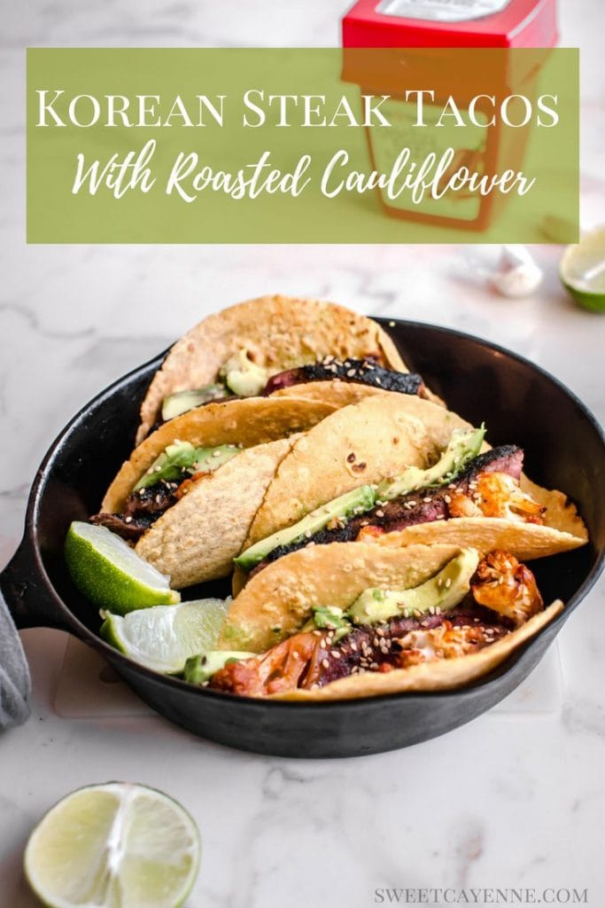 A side shot of tacos in a cast iron skillet with a box of gochujang sauce in the background.