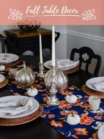 A fall decor tables cape with mercury glass pumpkins, candlesticks, and velvet pumpkins.
