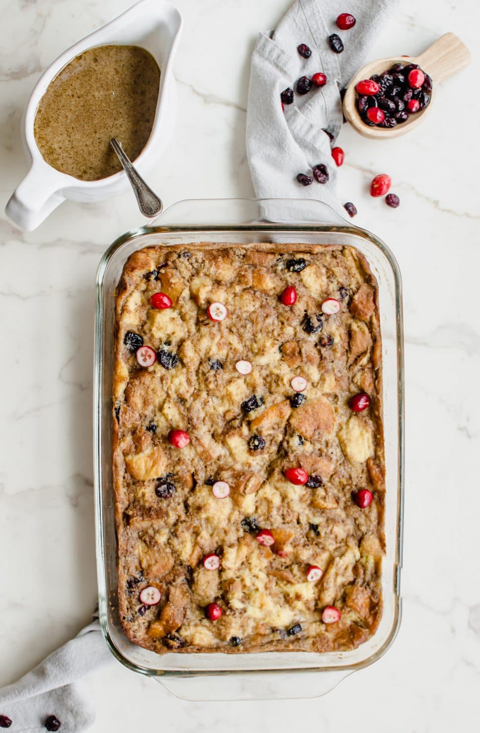 Glass casserole dish with a baked bread pudding.