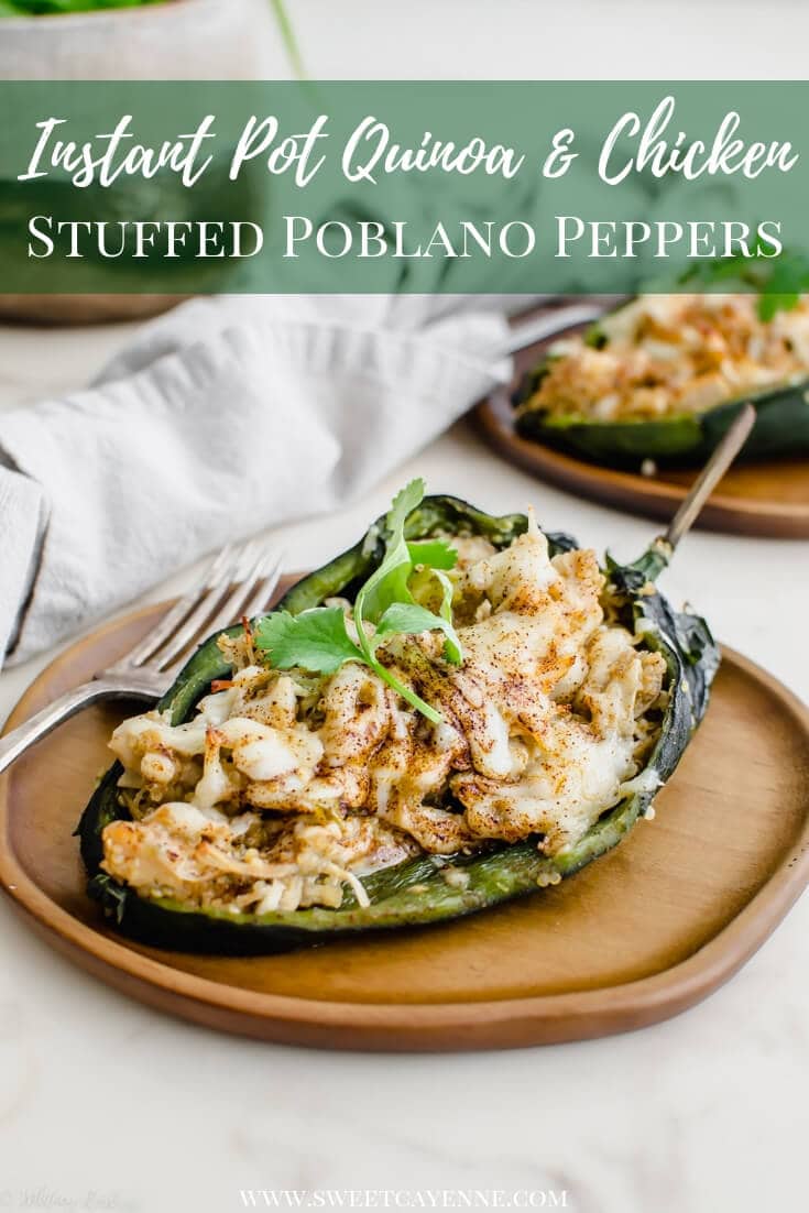 A stuffed poblano pepper on a wood plate. 