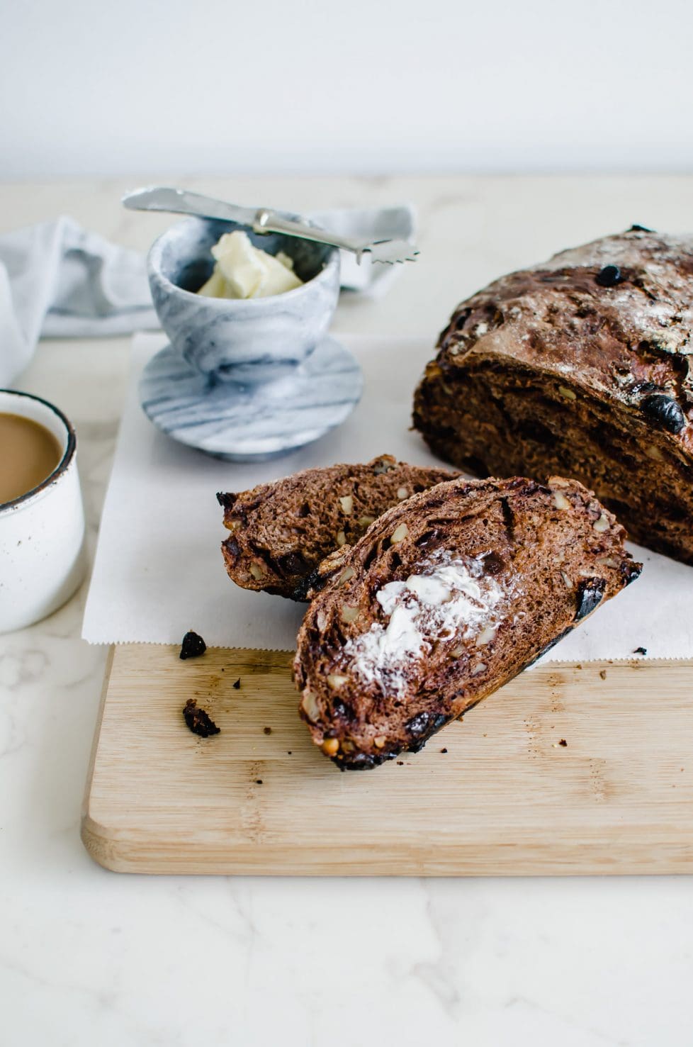 Sliced chocolate bread on a cutting board.