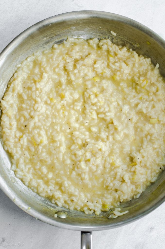 A skillet with lemon risotto. 