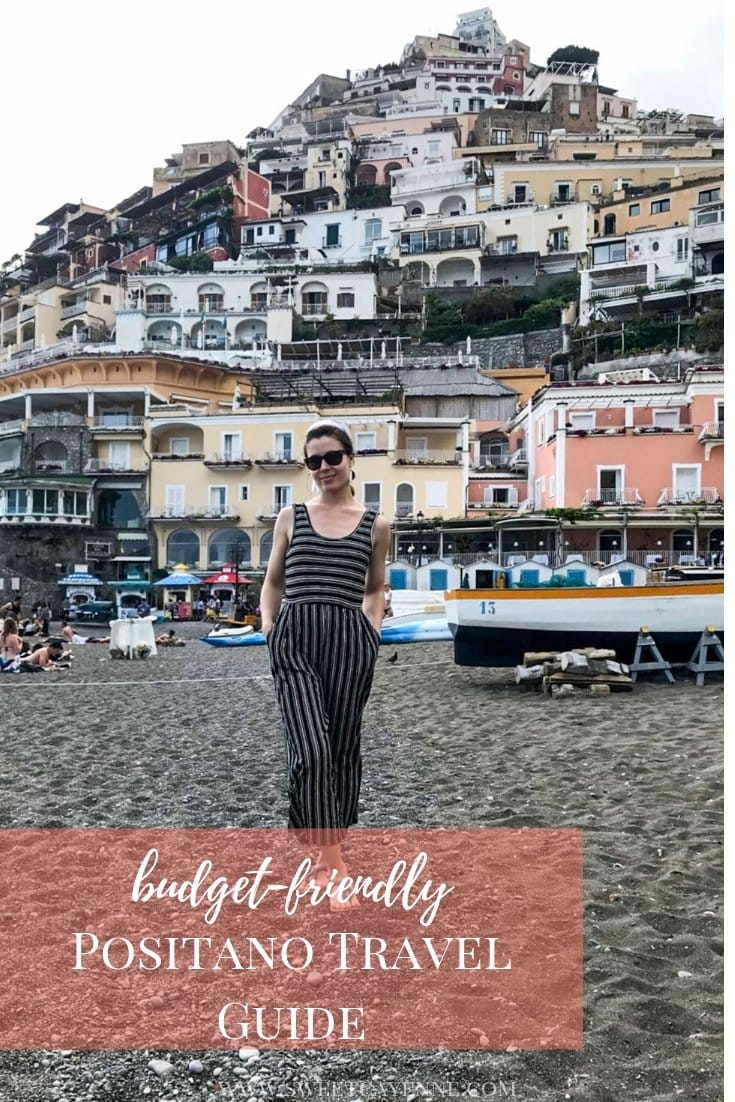 A girl standing on a beach in Positano, Italy.