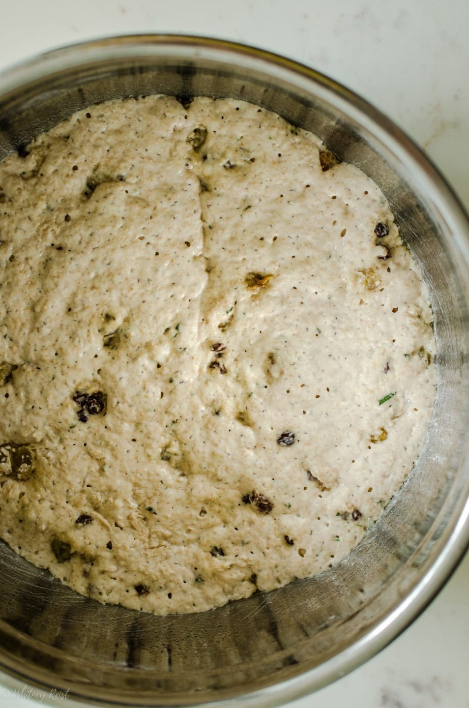 A bowl with fermented bread dough for bread rising.