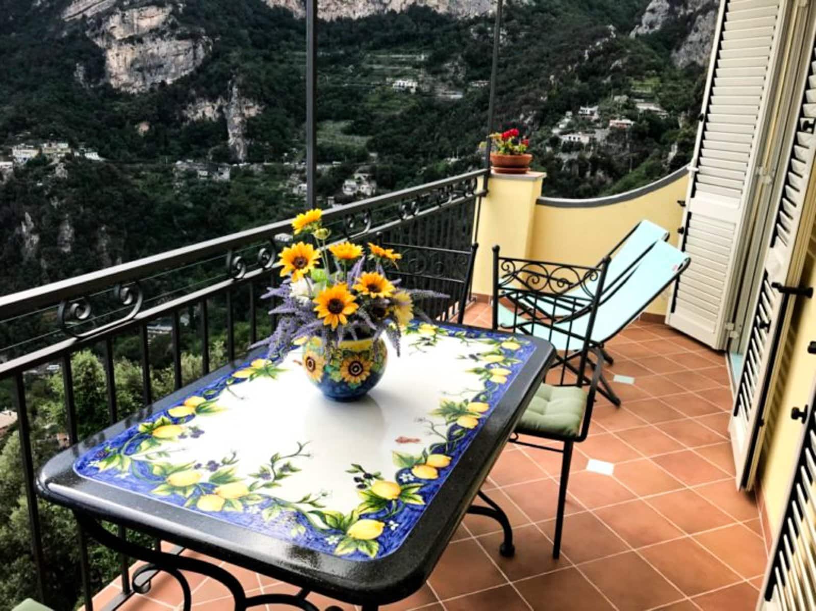 A table on an outdoor porch in Positano.