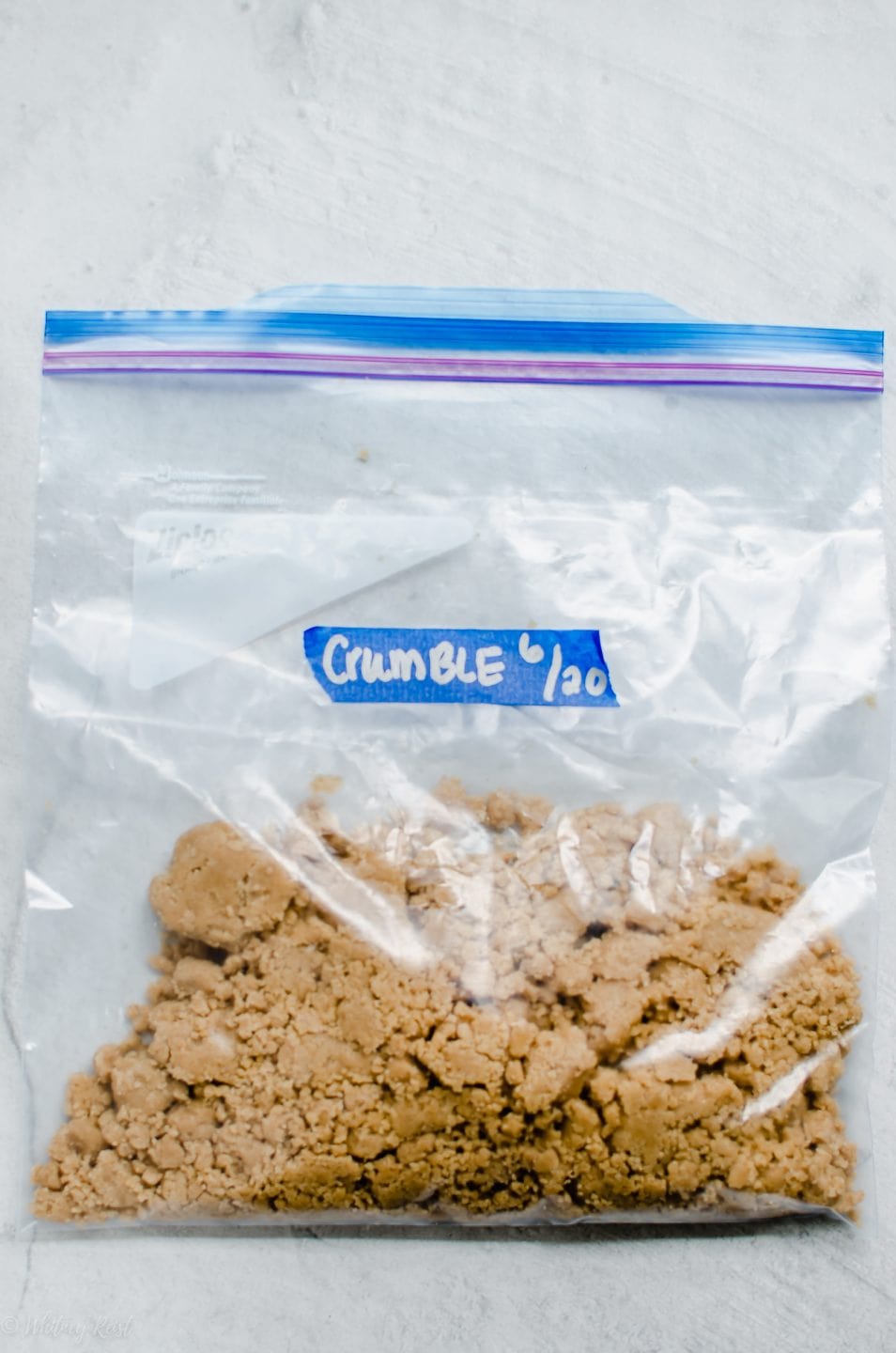 A freezer bag filled with fruit crumble topping.