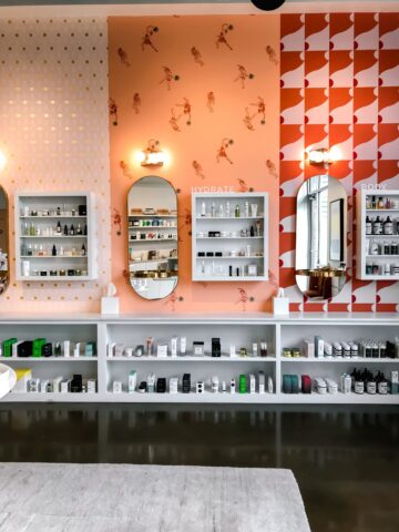The product wall of skincare items at Lemon Laine Oil Bar in Nashville, TN.