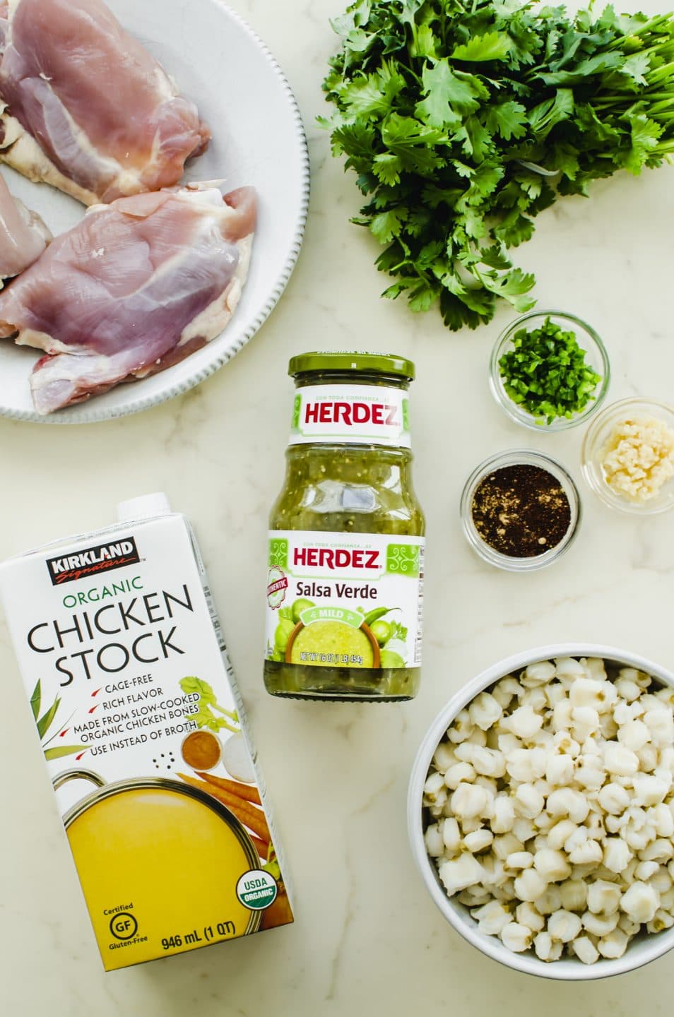 An overhead shot of the ingredients for Chicken Posole Verde.