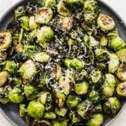 An overhead shot of a plate of crispy Brussels sprouts.