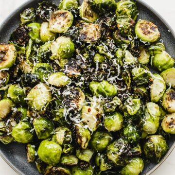 An overhead shot of a plate of crispy Brussels sprouts.