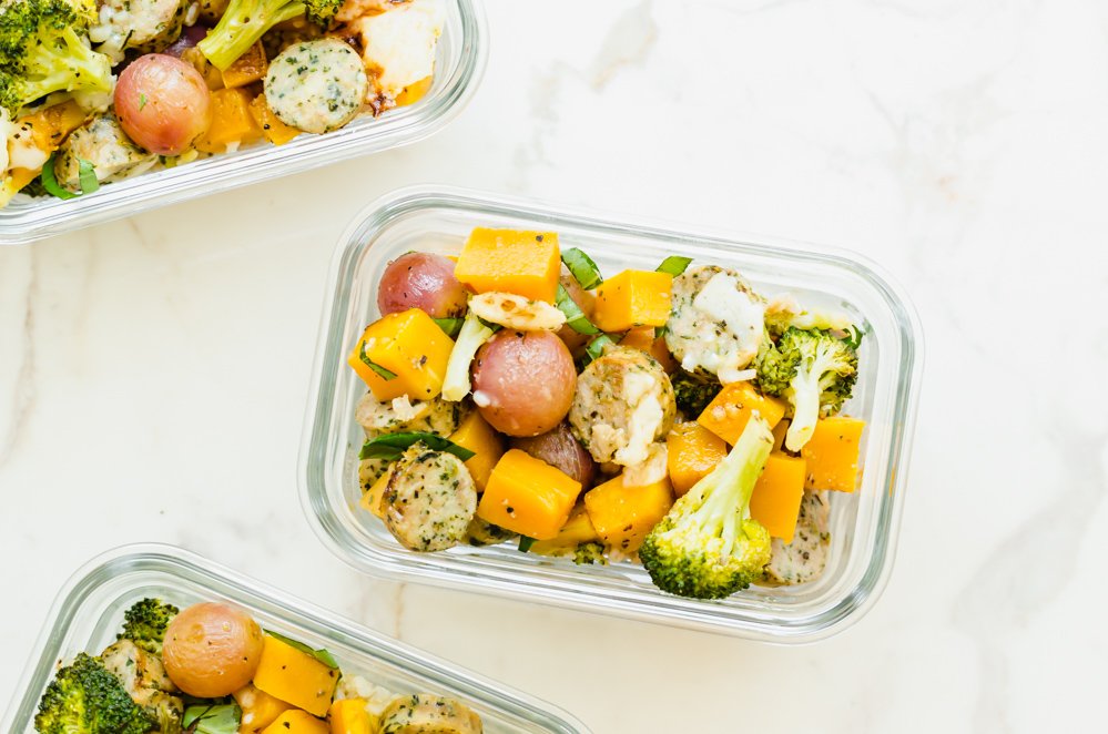 Glass meal prep containers filled with roasted veggies.