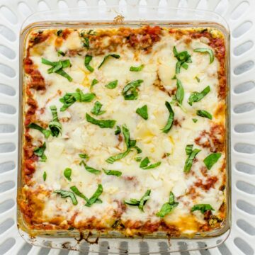 An overhead shot of a glass baking dish filled with baked Turkey Florentine Lasagna.