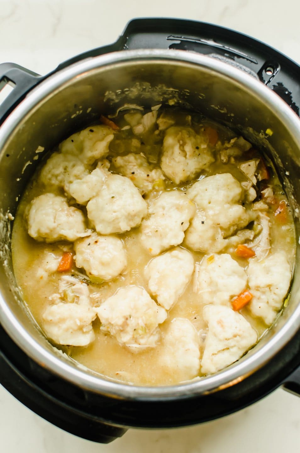Turkey and dumplings inside of an Instant Pot. 