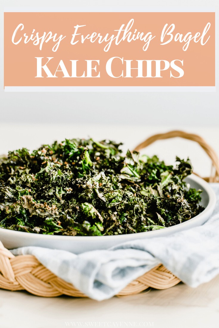 A side shot of a plate of kale chips on a gingham dish towel inside a rattan charger.