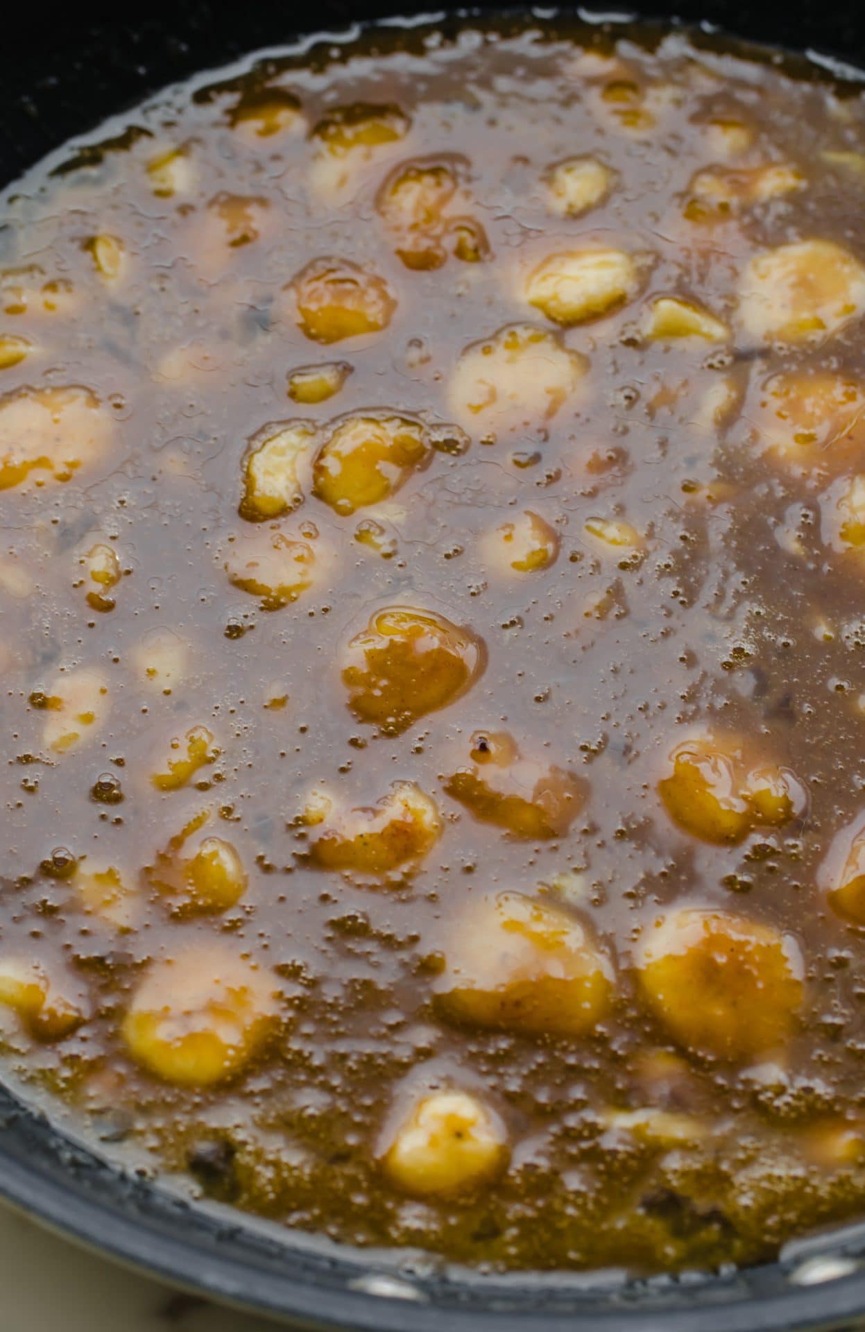 A caramelized banana mixture in a large skillet.