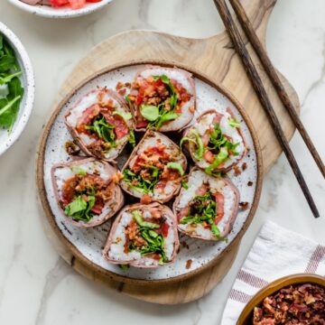 An overhead shot of a plate of beefshi with chopsticks on the side.