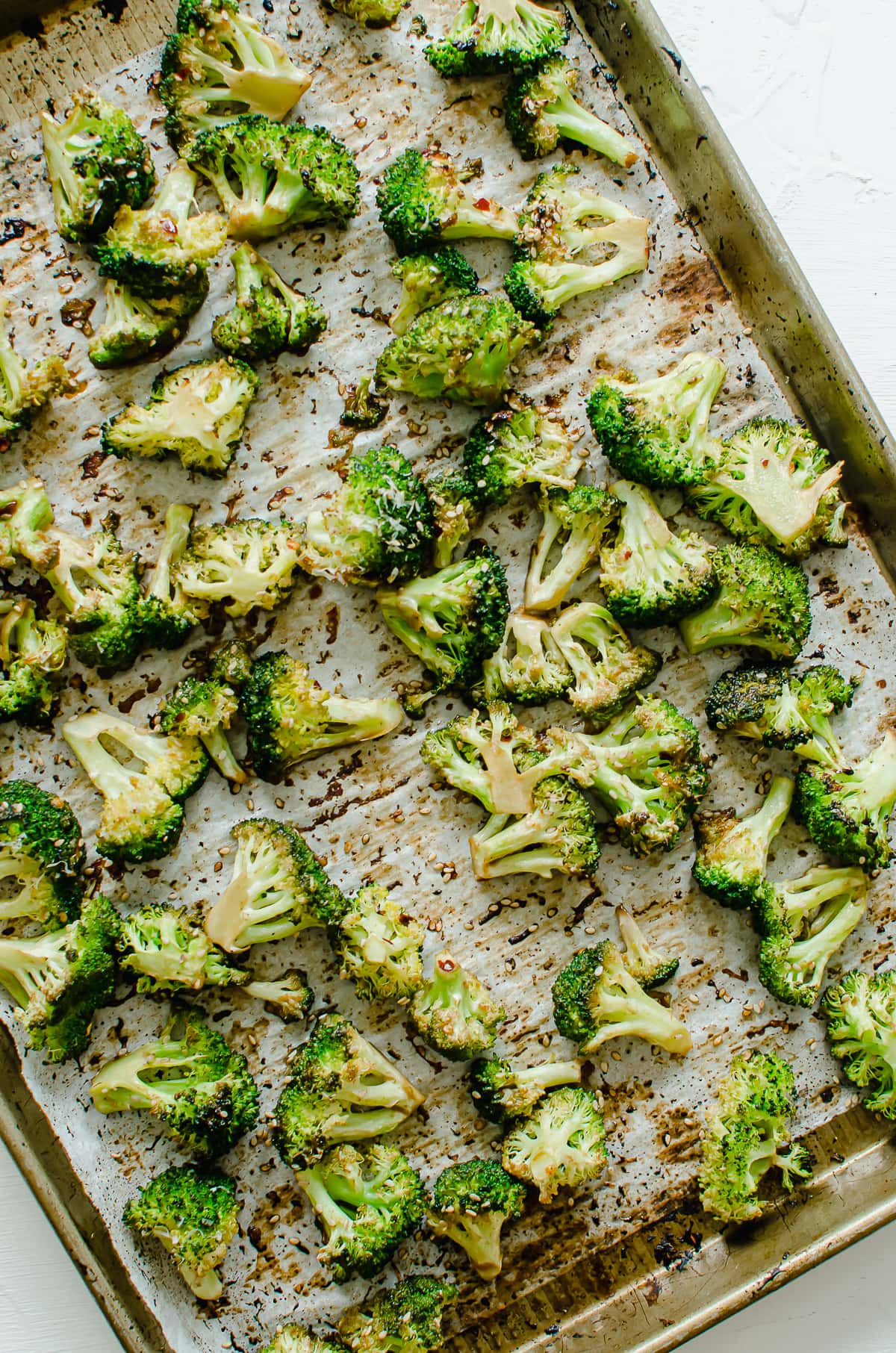 A sheet pan with sesame roasted broccoli.