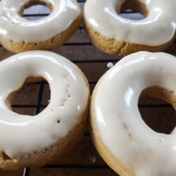 A close-up shot of apple cider donuts with maple glaze.